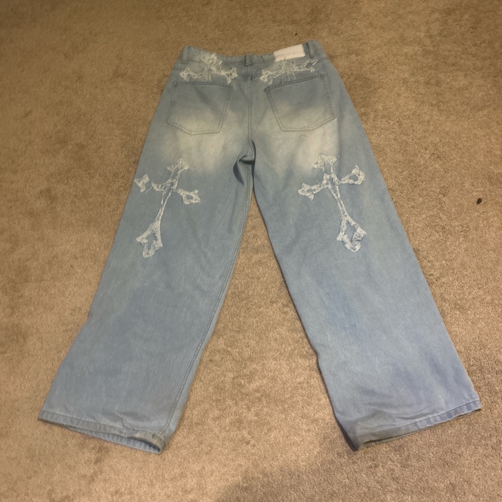 Blue Relaxed Fit Jeans with Distressed Details